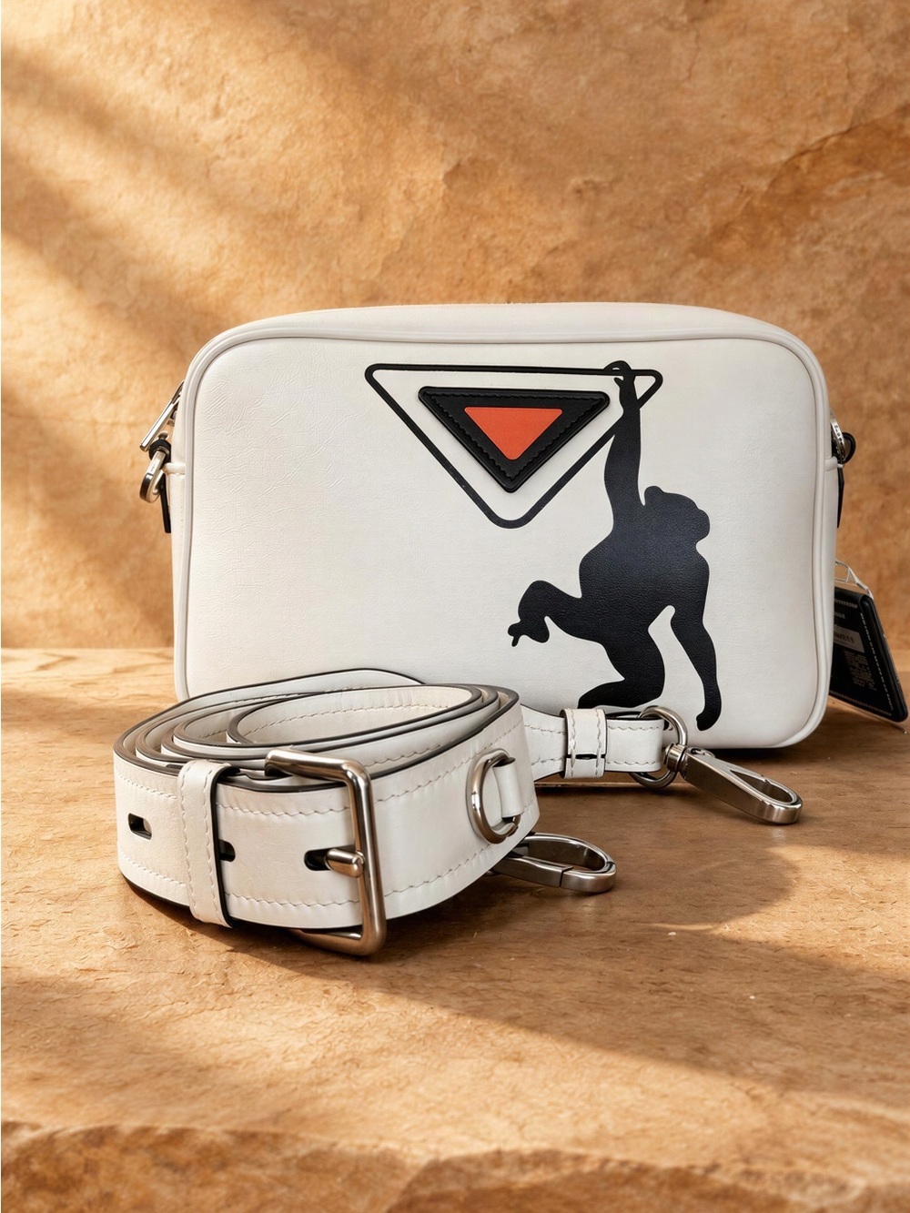Prada White Leather Messenger Bag with Black Ape Motif and Orange Triangle